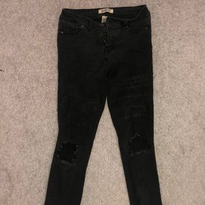 Blue spice distressed black skinny jeans